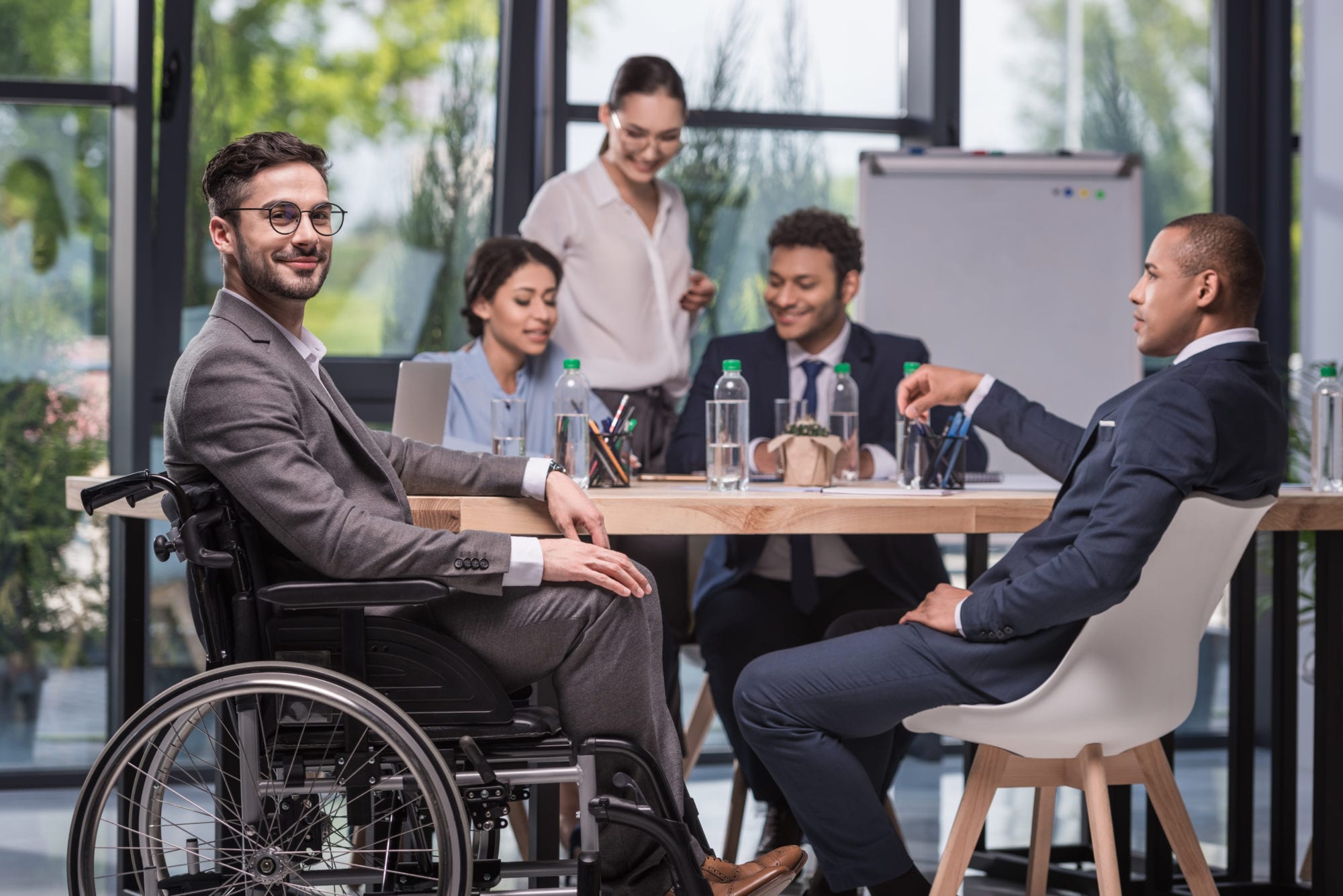 smiling disabled businessman in wheelchair